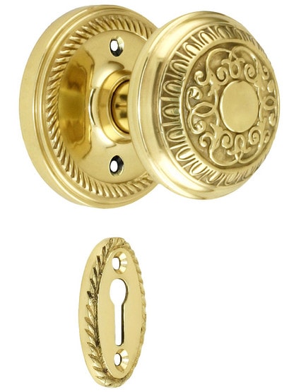 Rope Rosette Mortise Lock Set With Egg And Dart Door Knobs in Polished Brass.